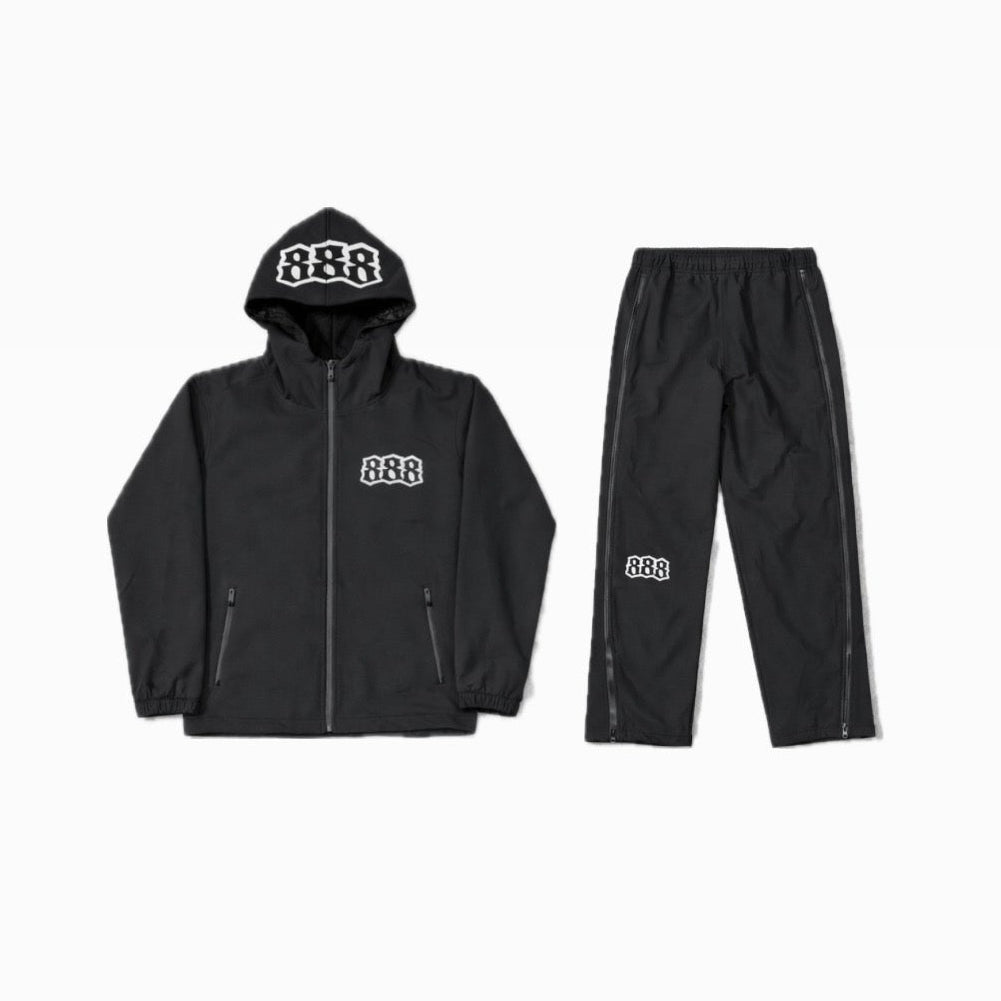 Black jacket and pants set with visible branding on a white background