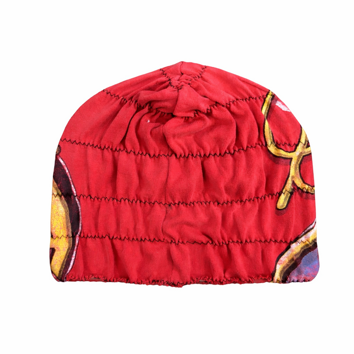 Red beanie with gold and black design on a white background