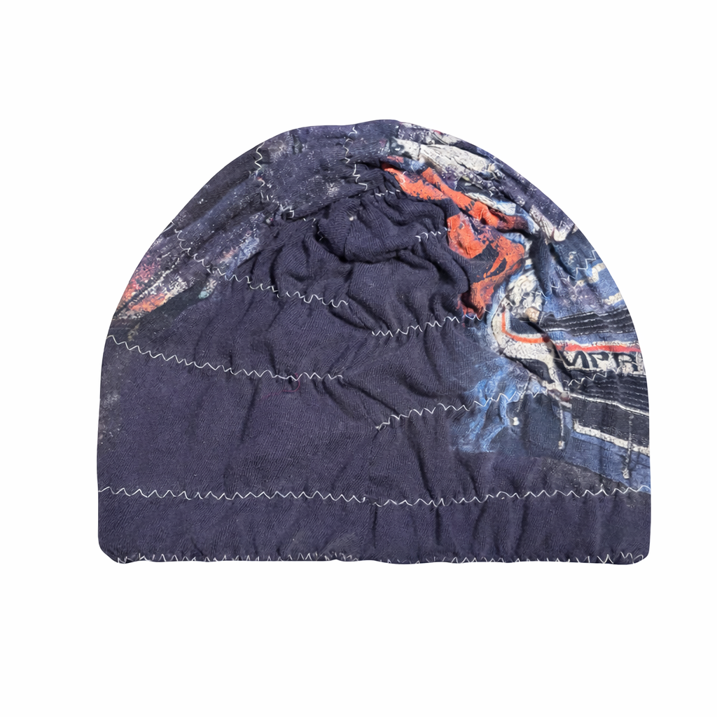 Navy blue beanie with colorful patterns on a white background