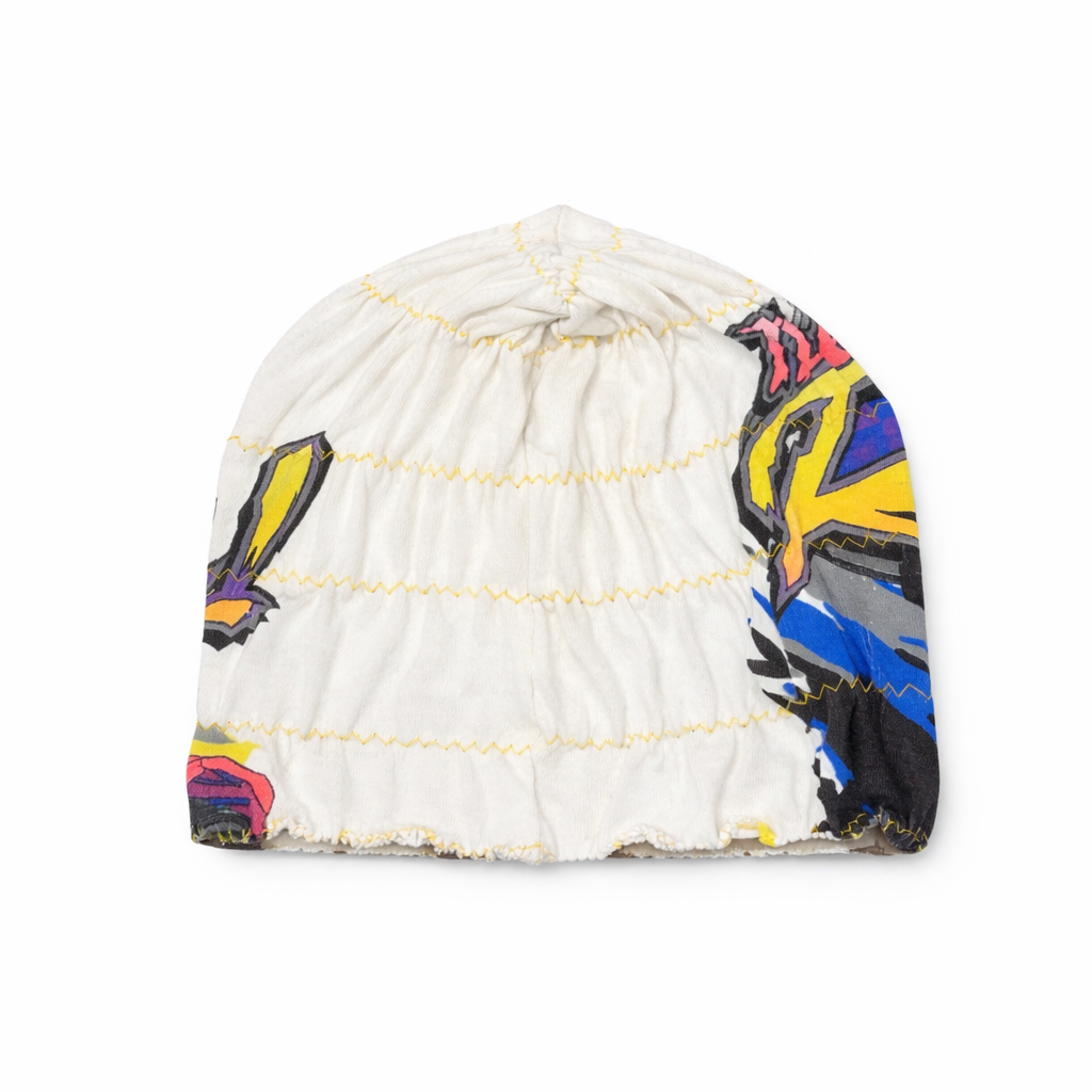 Colorful beanie with butterfly design on a white background