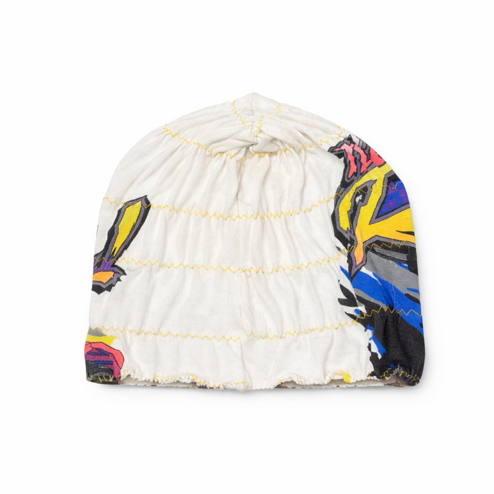 Colorful beanie with butterfly design on a white background