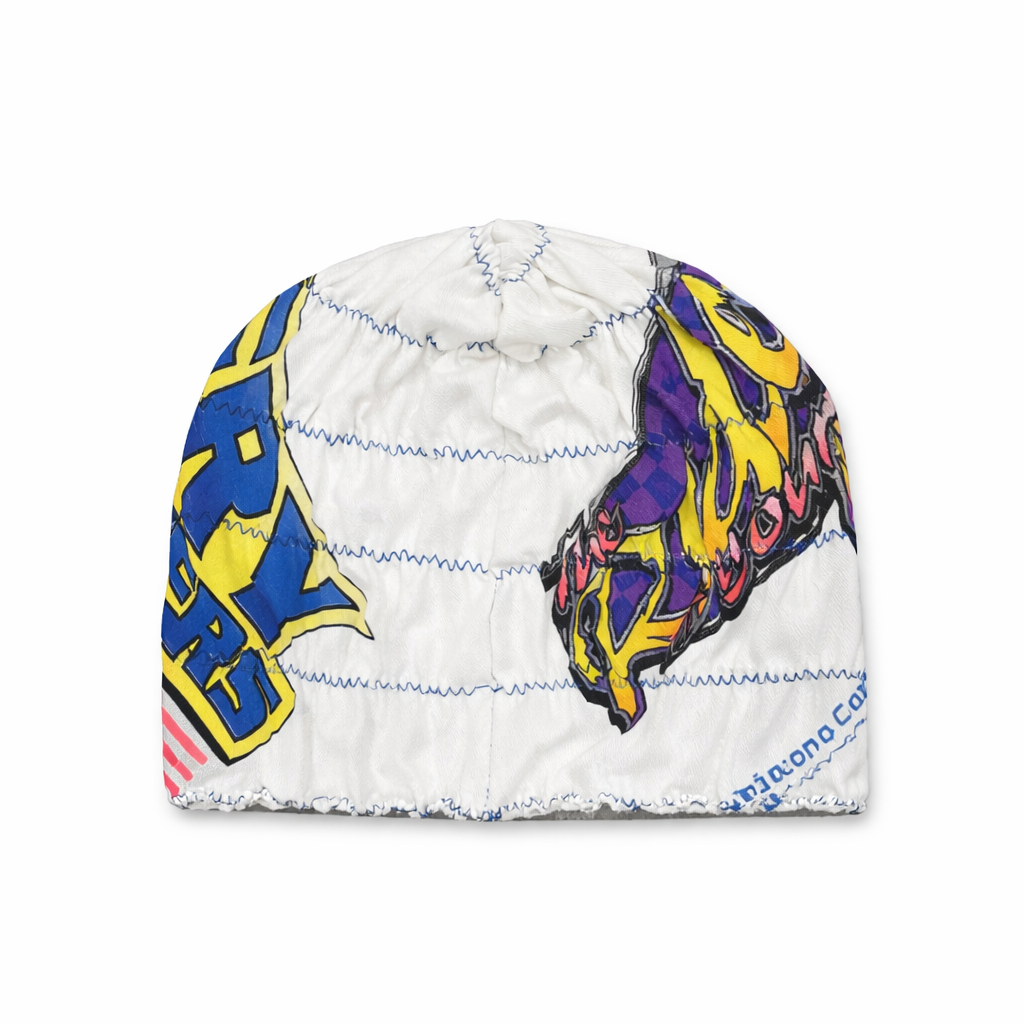 White beanie with colorful abstract designs on a white background