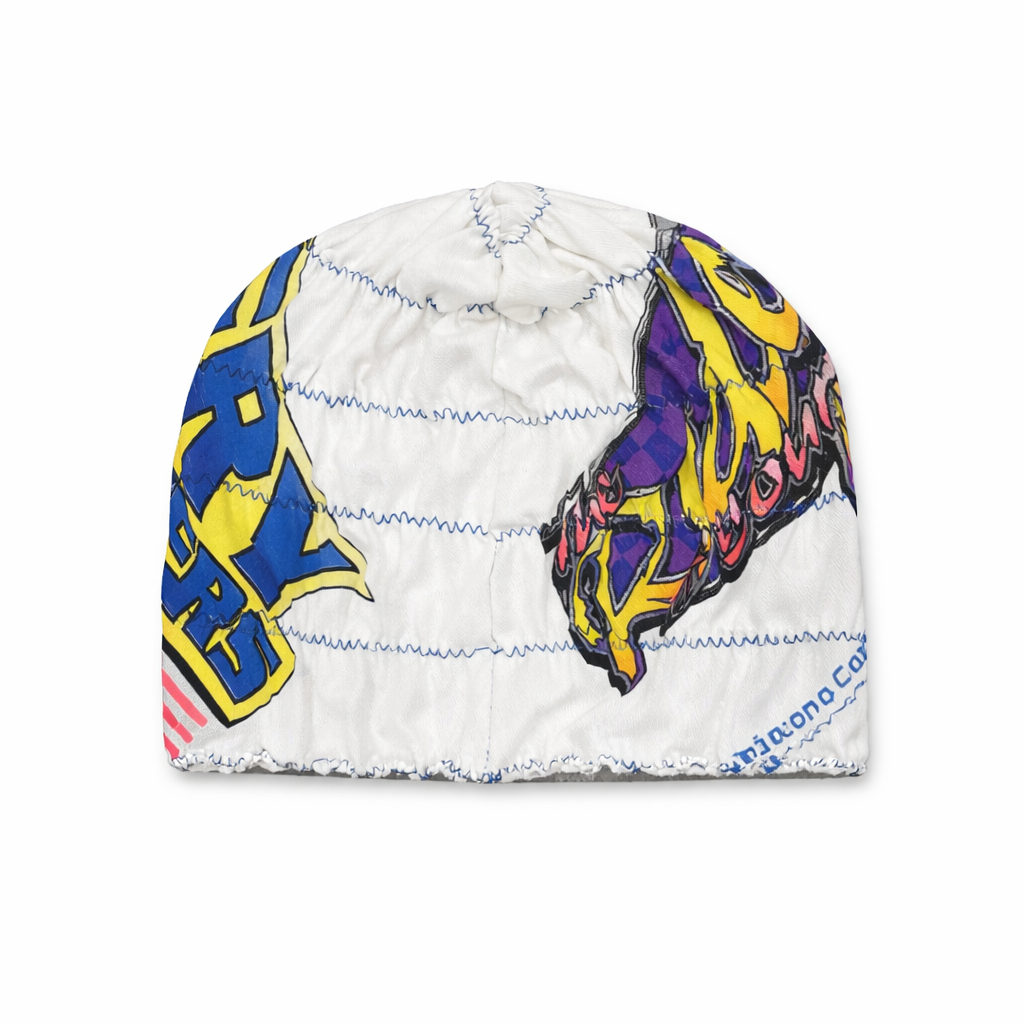 White beanie with colorful abstract designs on a white background